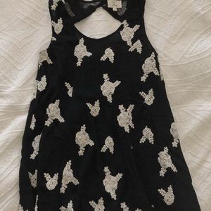 Boutique black dress with cream flower detail